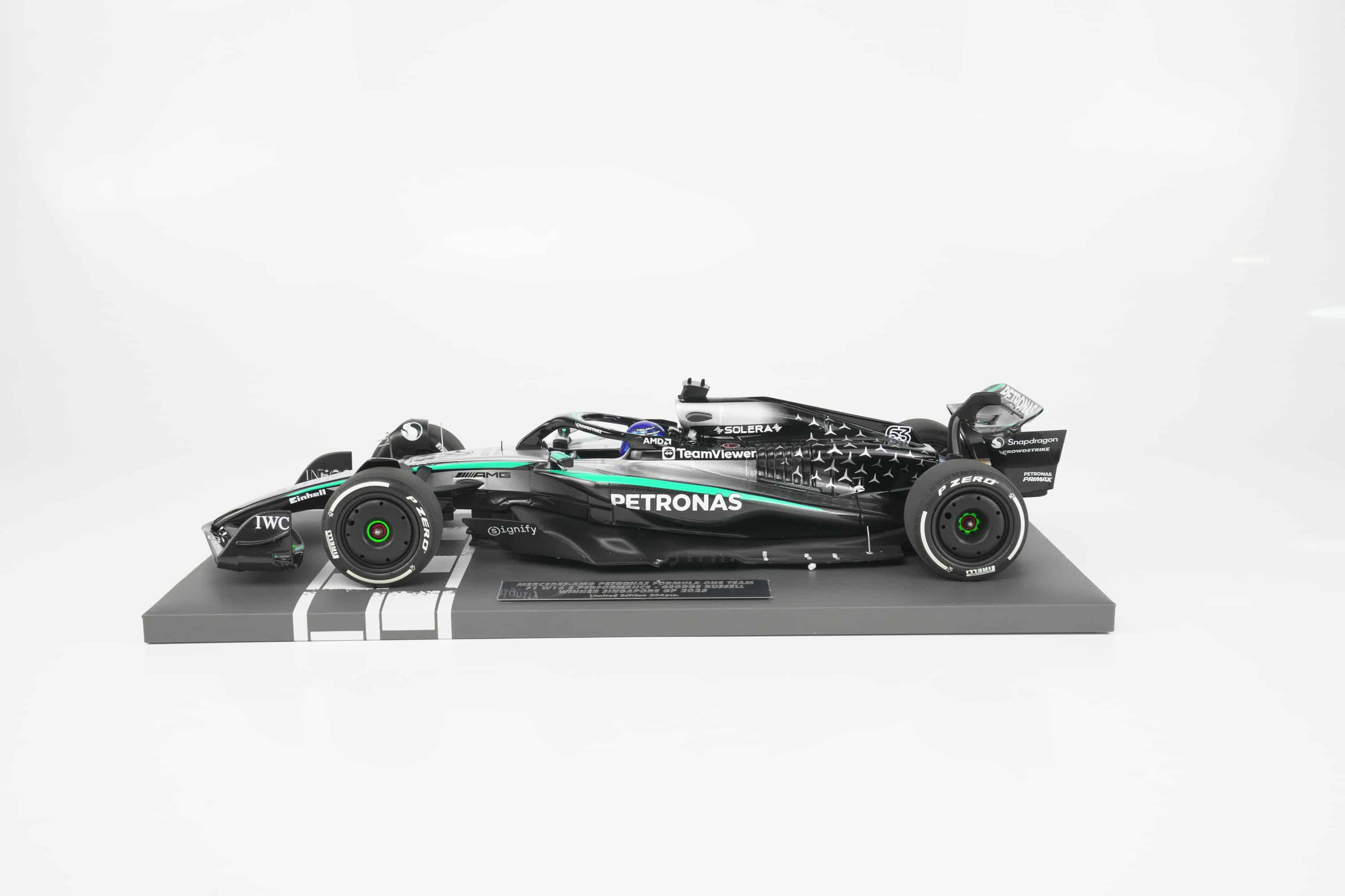 Minichamps 1:18 Mercedes-AMG Petronas F1 Team W16 E Performance No.63 George Russell Winner Singapore GP 2025 (117251863) Limited Edition Resin Model 5 Minichamps 1:18 Mercedes-AMG W16 E Performance No.63 George Russell Winner Singapore GP 2025 black silver resin model (117251863) - side view on display base