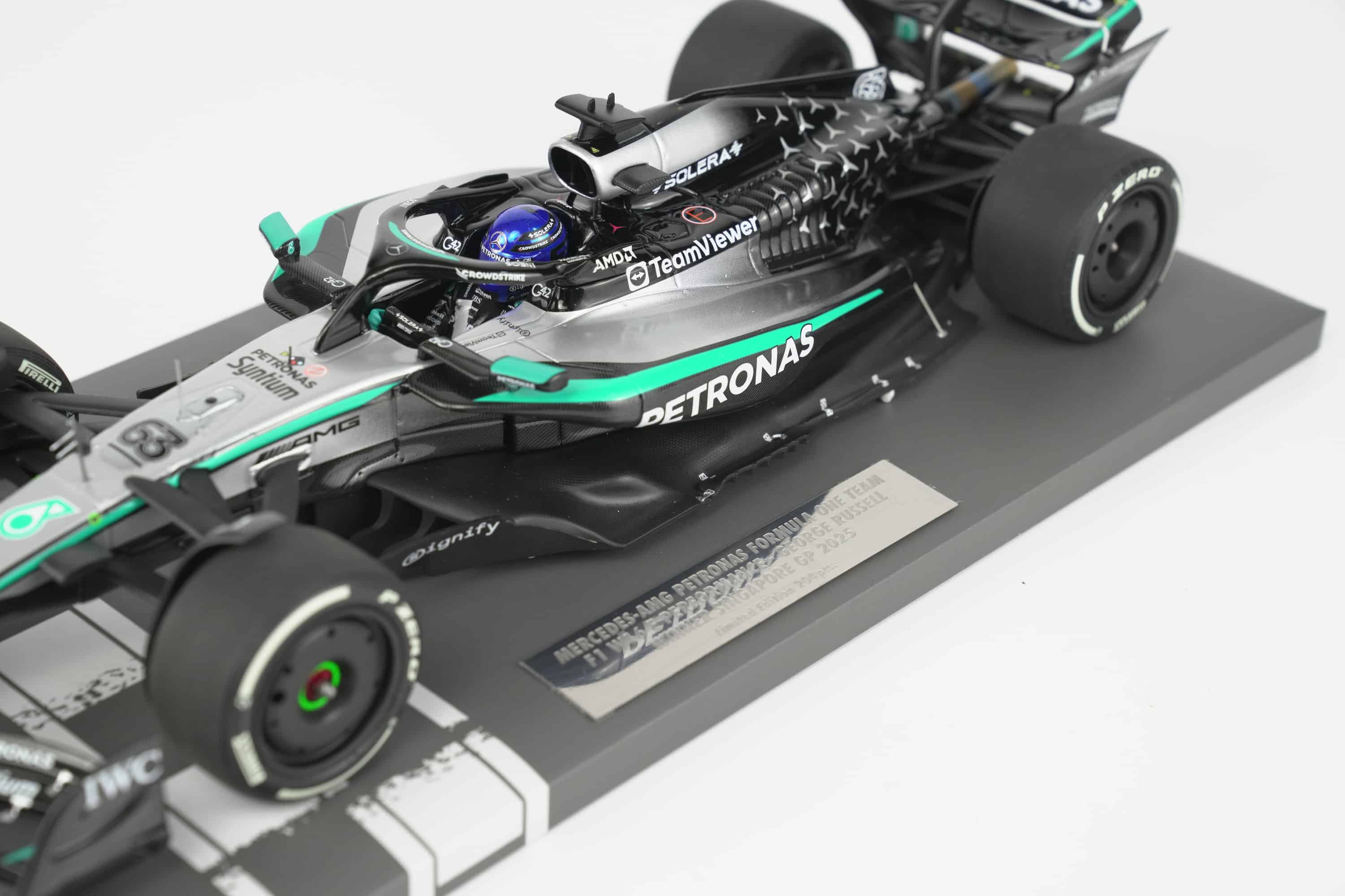 Minichamps 1:18 Mercedes-AMG Petronas F1 Team W16 E Performance No.63 George Russell Winner Singapore GP 2025 (117251863) Limited Edition Resin Model 8 Minichamps 1:18 Mercedes-AMG W16 E Performance No.63 George Russell Winner Singapore GP 2025 black silver resin model (117251863) - cockpit and sidepod detail