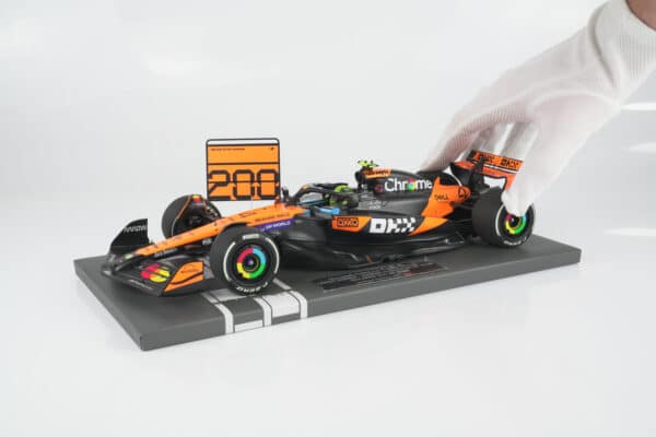 Minichamps 1:18 McLaren MCL39 No.4 Lando Norris Winner Hungarian GP 2025 McLaren 200 GP Wins with Pit Board (537253104) Limited Edition Resin Model 12 Minichamps 1:18 McLaren MCL39 No.4 Lando Norris Winner Hungarian GP 2025 McLaren 200 GP Wins resin model (537253104) - held in white glove to show scale