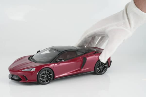 GT Spirit 1:18 McLaren GTS Red 2023 (GT971) Limited Edition Resin Model 13 GT Spirit 1:18 McLaren GTS Red 2023 (GT971) resin model – held in white-gloved hand for scale