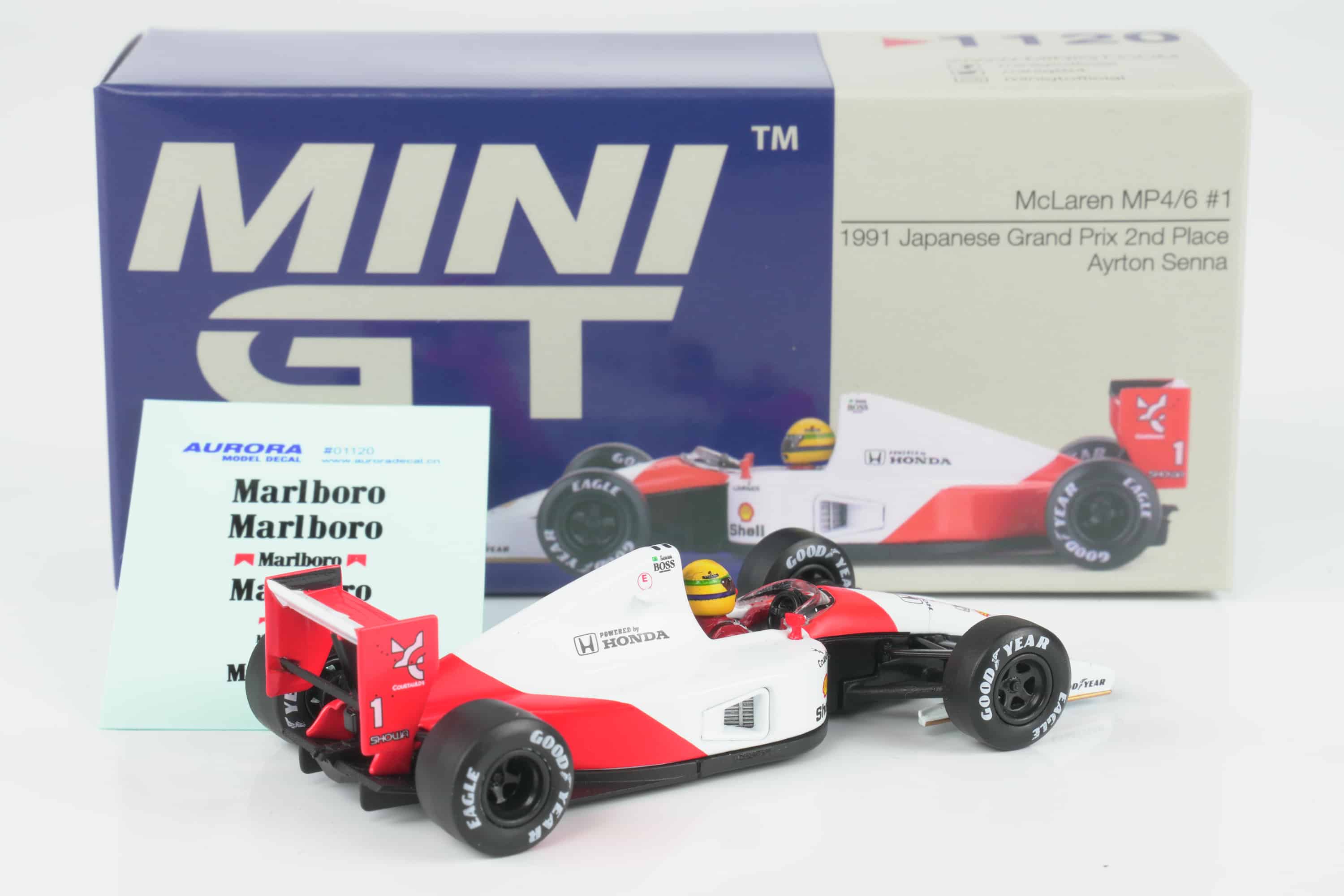 Mini GT - 1:64 McLaren MP4/6 No.1 Ayrton Senna 2nd Place Japanese GP 1991 - Diecast Model 2 Mini GT 1:64 McLaren MP4/6 No.1 Ayrton Senna 2nd Place Japanese GP 1991 diecast model (MGT01120-L) - with box, rear three-quarter