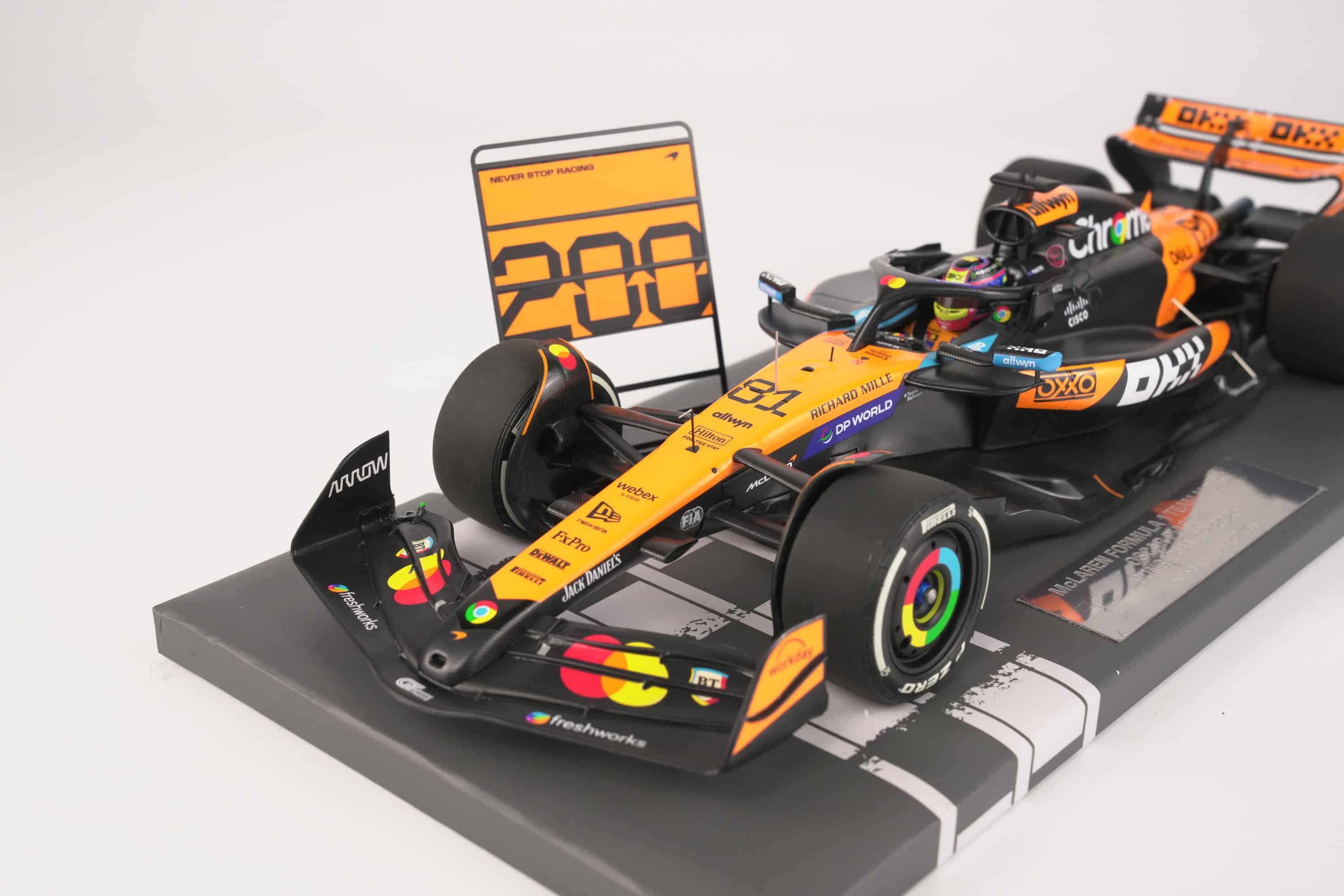 Minichamps 1:18 McLaren MCL39 No.81 Oscar Piastri 2nd Hungarian GP 2025 McLaren 200 GP Wins with Pit Board (537253181) Limited Edition Resin Model 5 Minichamps 1:18 McLaren MCL39 No.81 Oscar Piastri 2nd Hungarian GP 2025 resin model with 200 pit board (537253181), front three-quarter with 200 pit board