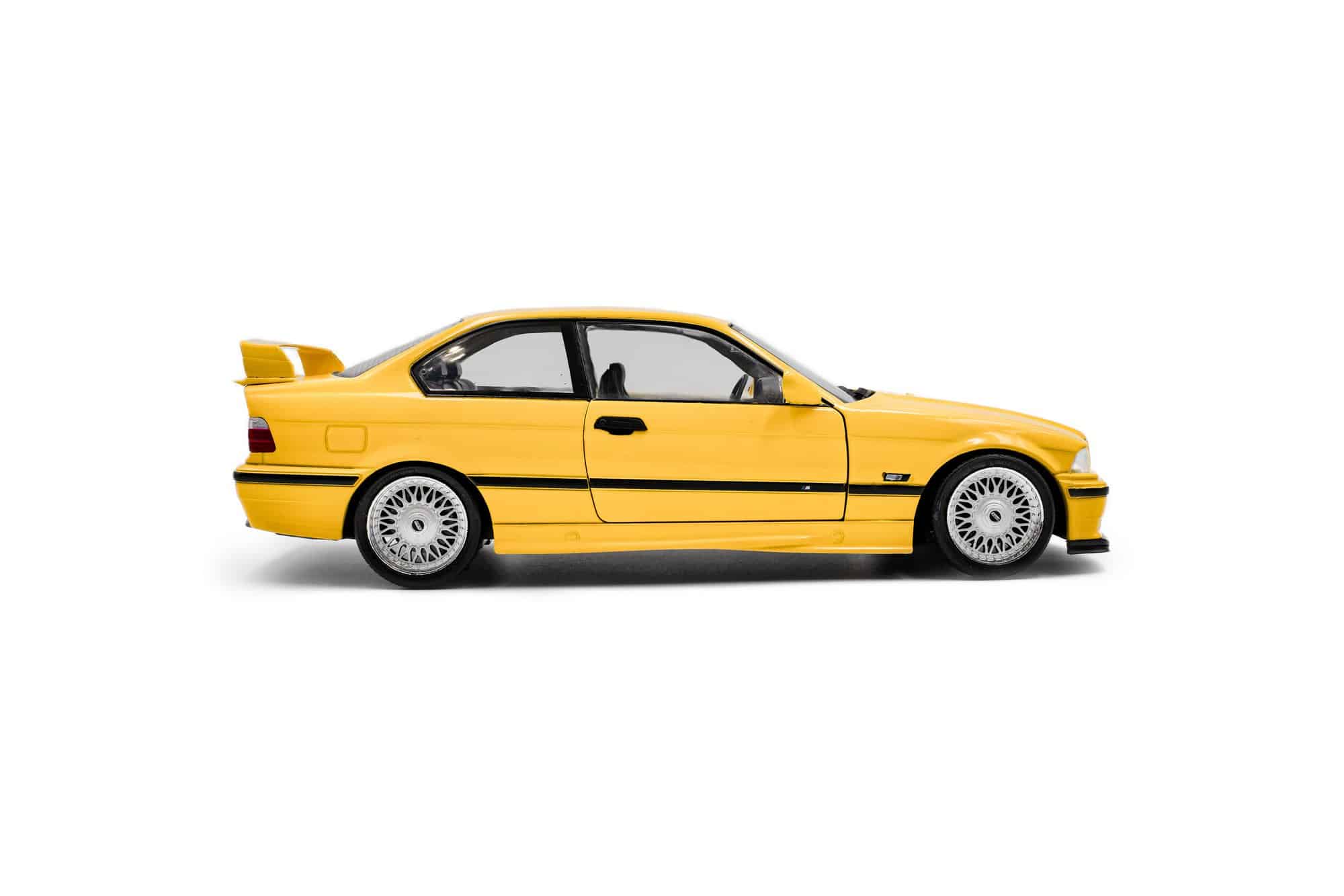 Solido 1:18 BMW M3 (E36) Coupe Dakar Yellow 1991 (S1803917) Diecast Model 5 Solido 1:18 BMW M3 (E36) Coupé Solido Works Dakar Yellow 1991 (S1803917) diecast model – side view